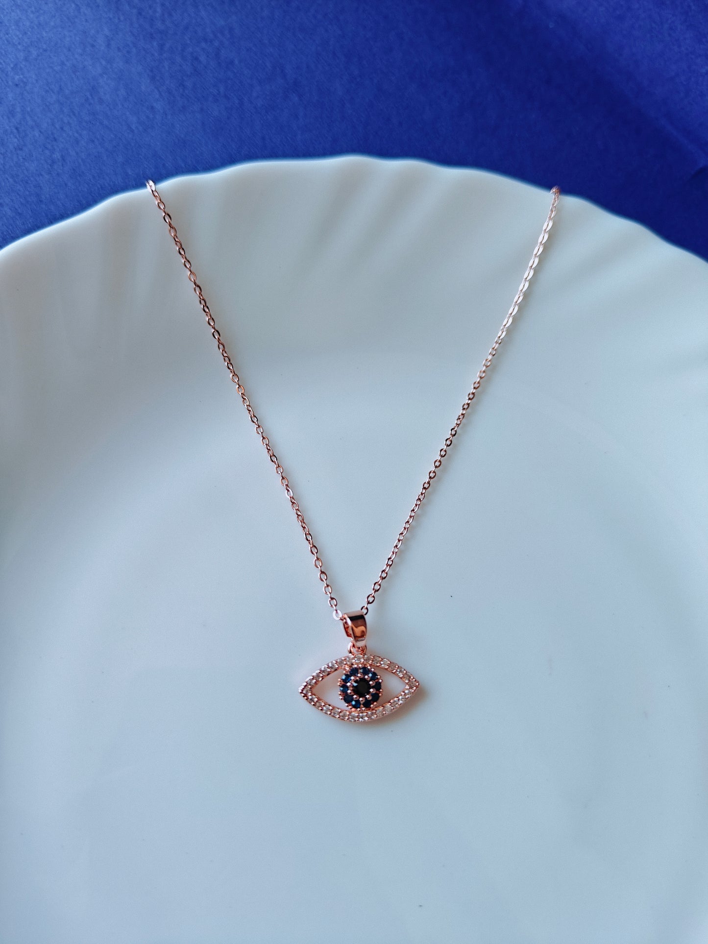 ROSEGOLD EVIL EYE Q E1'